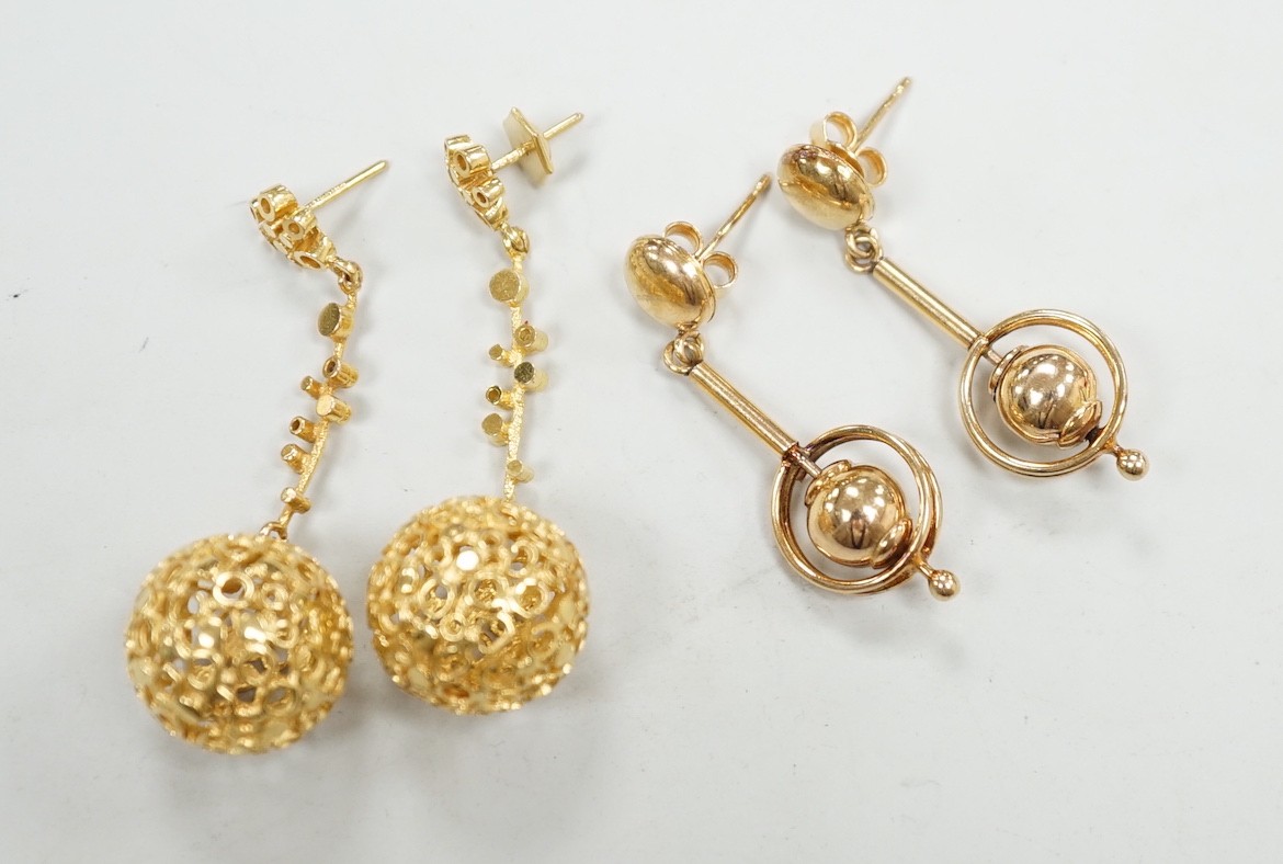 A modern pair of pierced 9ct gold globe drop earrings, 47mm and one other pair of 9ct drop earrings, 17.1 grams.
